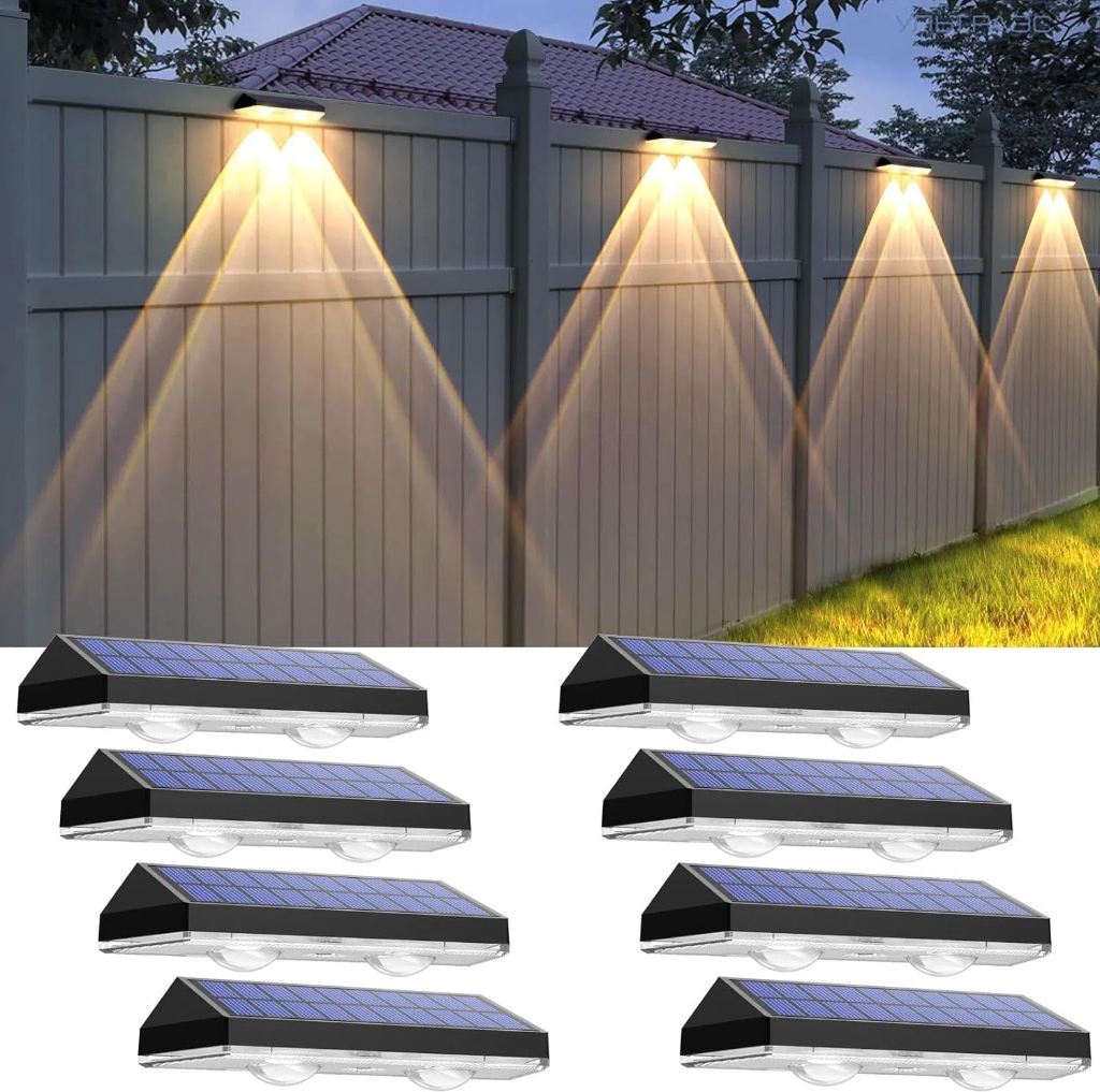 Voltraic 8-pack warm white outdoor solar fence deck and wall accent lights illuminating backyard wooden fence at night
